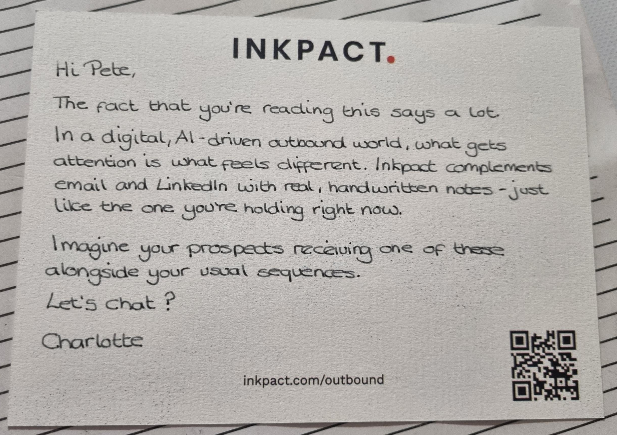 An Inkpact handwritten note card addressed to Pete, sitting on a lined surface, featuring the Inkpact logo at the top and a QR code linking to inkpact.com/outbound
