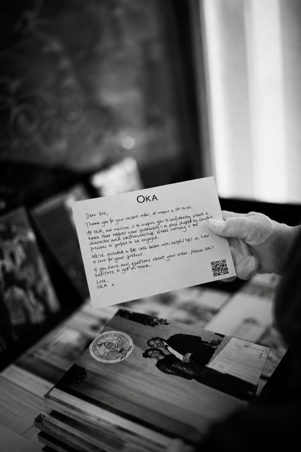 OKA thank-you handwritten note held by a team member