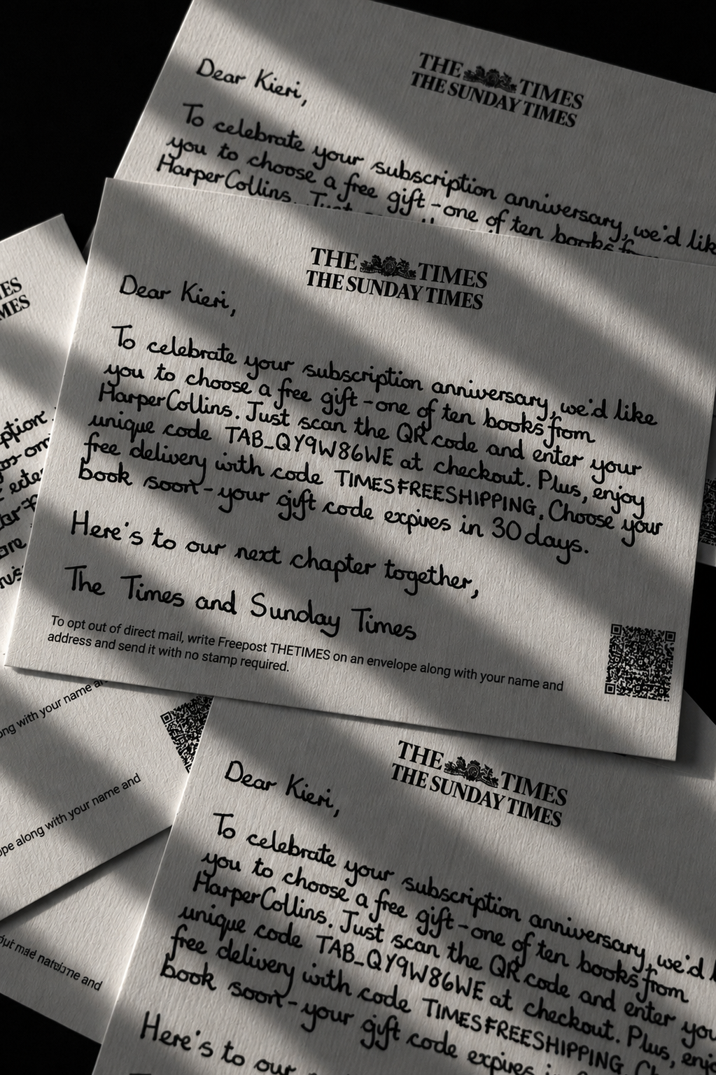 The Times and Sunday Times personalised handwritten subscription anniversary notes fanned out on a dark surface