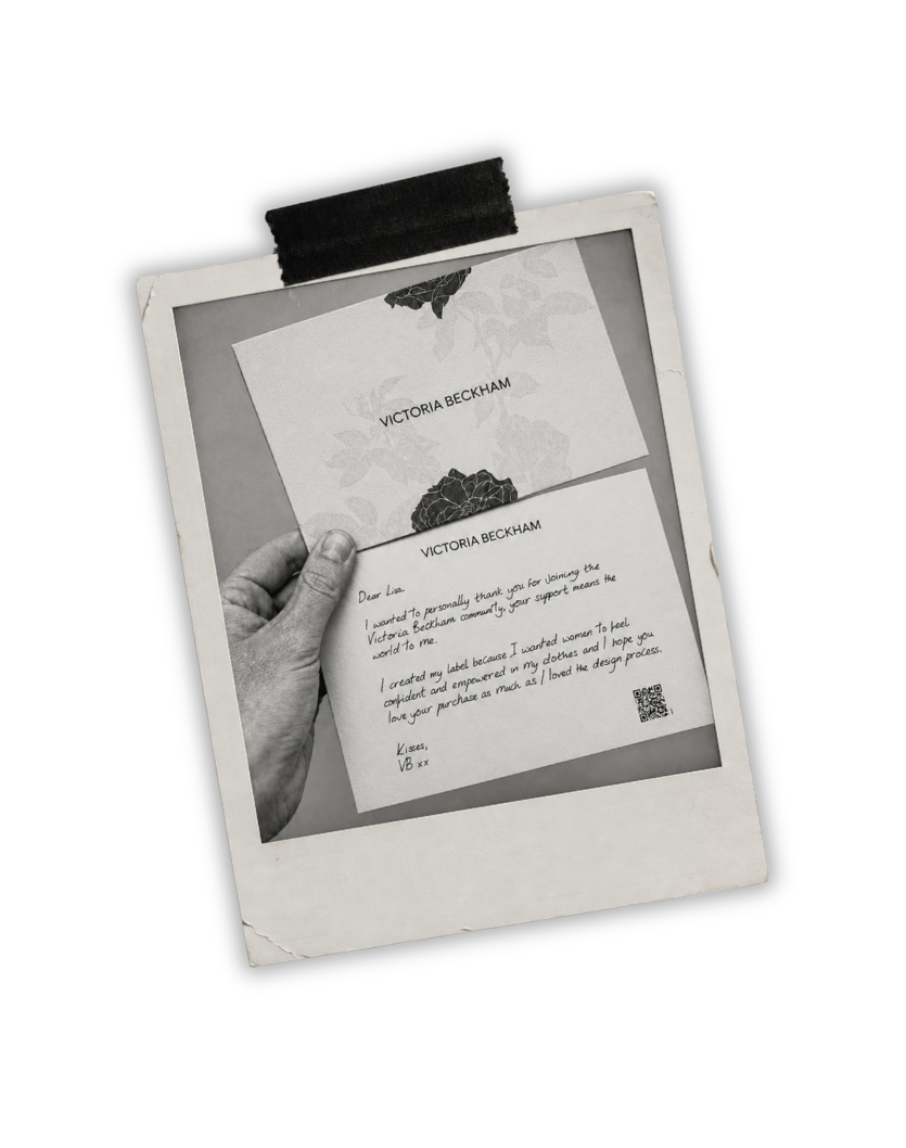 Polaroid photograph of a handwritten Victoria Beckham note